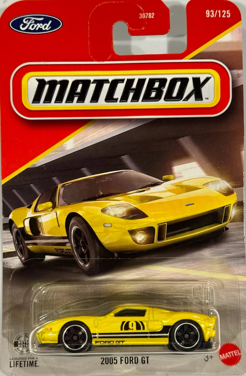 JHM82-001: Matchbox 2005 Ford GT JHM82 in yellow with black stripes and number 9 graphics on sealed card, 2026 release 93/125.